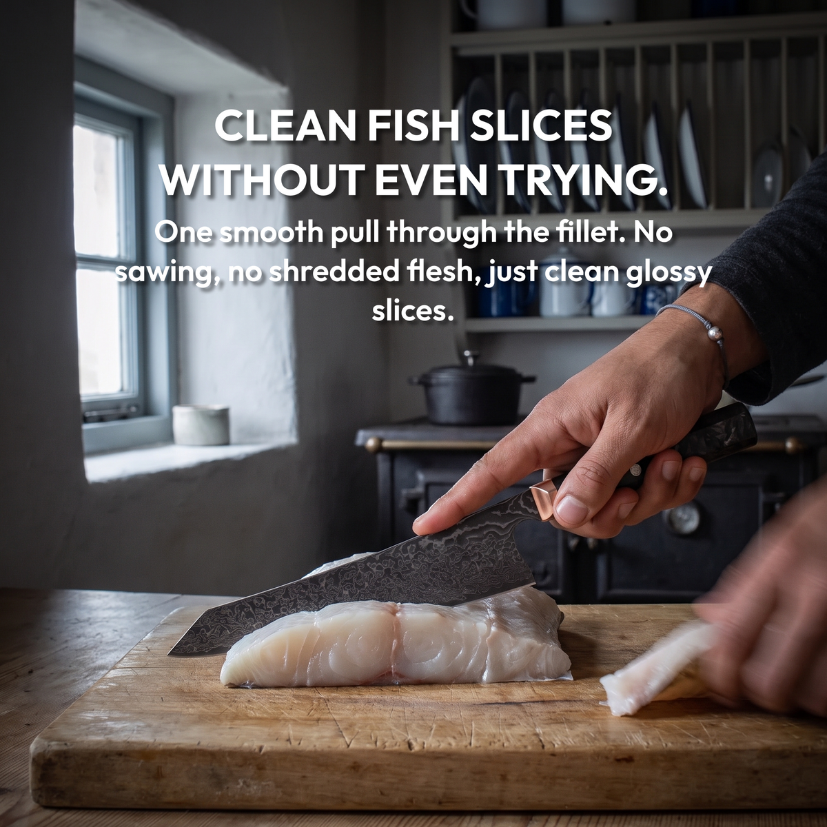 Kiritsuke Knife 21 cm, Galaxy Obsidian, slicing a white fish fillet