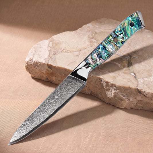 Utility Knife 13 cm, Japanese Damascus steel, Galaxy Aurora, abalone shell handle, on natural stone