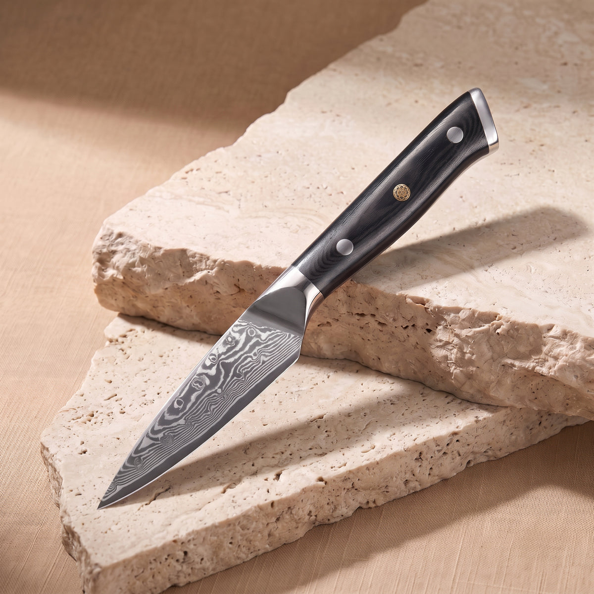 Paring Knife 9 cm, Japanese Damascus steel, Galaxy Orion, black G10 handle with gold pin, on natural stone